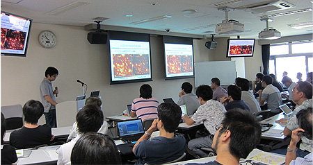 Dr. Yosuke Minowa, a Subaru Support Astronomer, is giving a presentation about Subaru's adaptive optics.